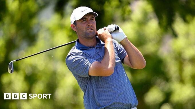 Scottie Scheffler watches his shot