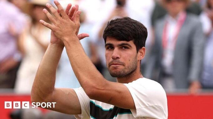Carlos Alcaraz claps his hands