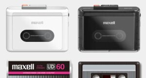Maxell MXCP-P100 dalam warna putih dan hitam, di samping kaset dan kotak Maxell 60 menit