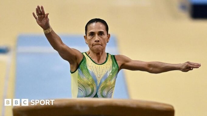 Oksana Chusovitina about to leap on a vault