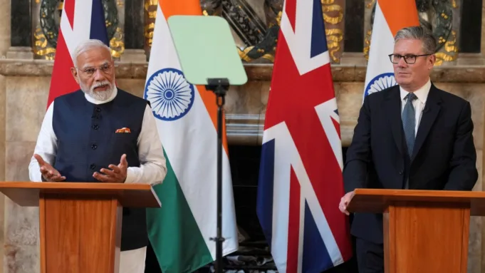 Prime Minister Narendra Modi and his British counterpart Keir Starmer speak during a press conference after signing a free trade agreement at Chequers near Aylesbury, England, on Thursday, July 24.    Kin Cheung/Pool via REUTERS
