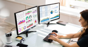 Woman using multiple screens