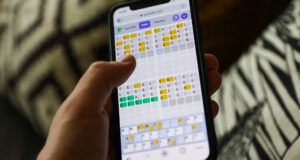 Quordle on a smartphone held in a hand