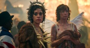 Billie Cassidy (Uni Meyers) and Kate Galloway (Julianne Nicholson) stand wearily in their soiled club costumes as London celebrates the end of World War 1 in a crowded Trafalgar Square in historical drama Dope Girls.