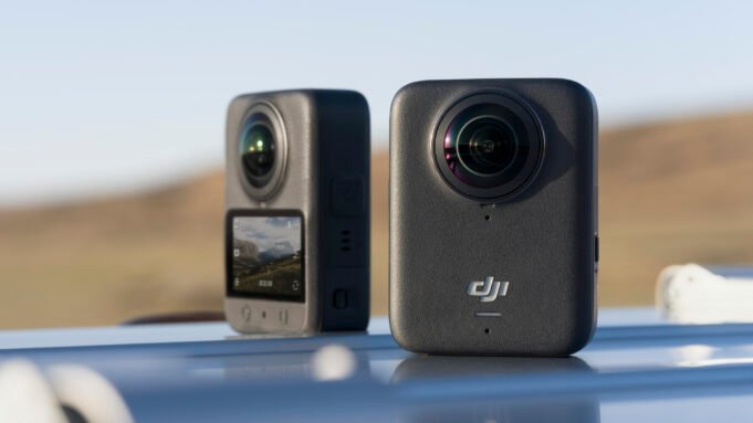 Two DJI Osmo 360 cameras on a car roof, front and back view