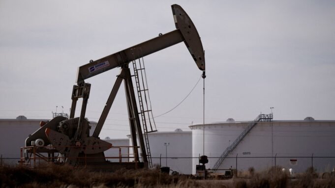A pump jack operates near a crude oil reserve 