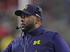 Universitas Michigan mempekerjakan Kyle Whittingham dari Utah untuk menjadi pelatih sepak bola berikutnya