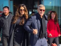 George Clooney, 64, berpegangan tangan dengan istrinya yang cantik Amal, 47, saat mereka tiba di Milan untuk upacara pembukaan Olimpiade Musim Dingin